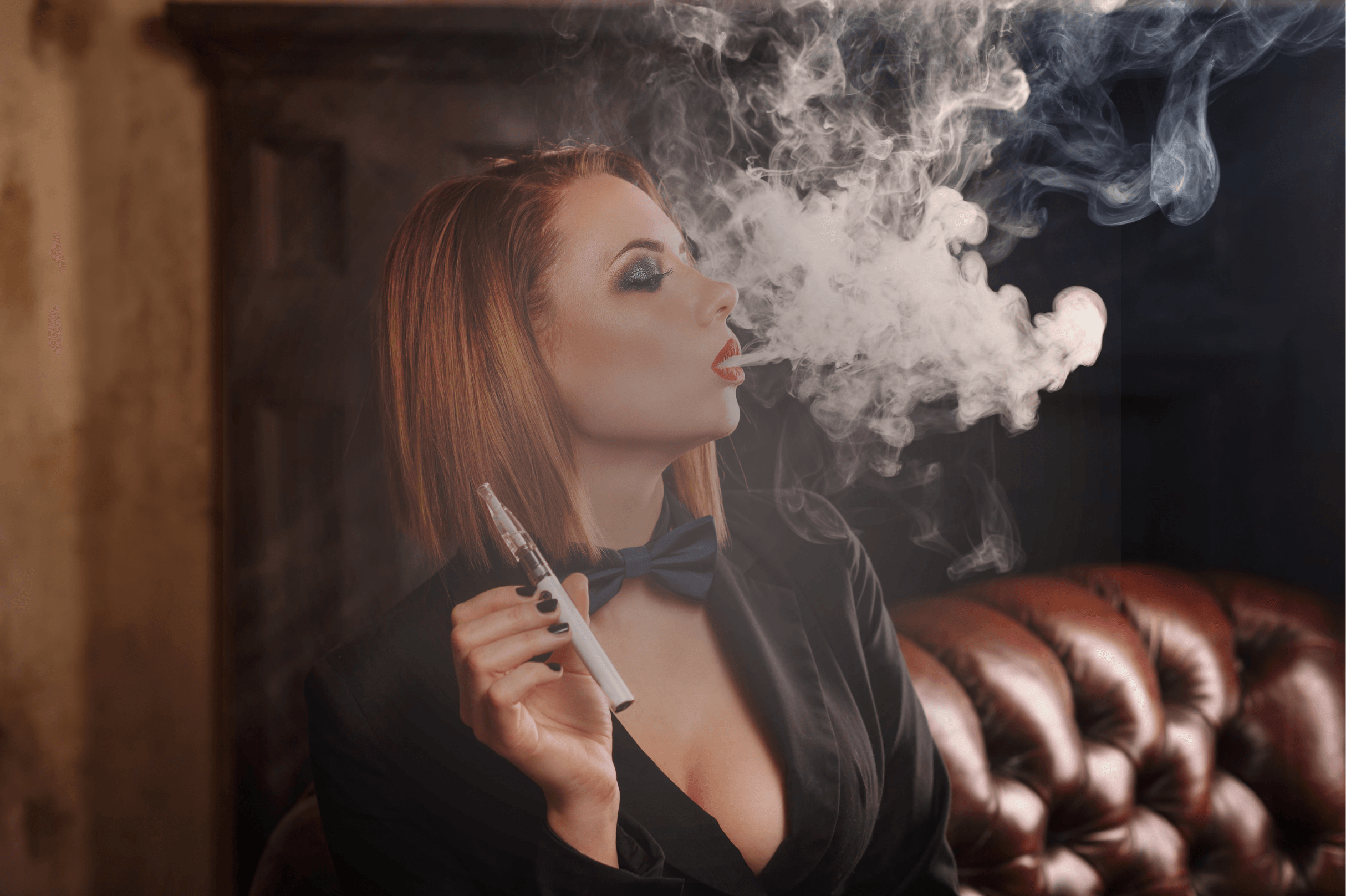 Confident woman in villain era styling, vaping in a dark setting