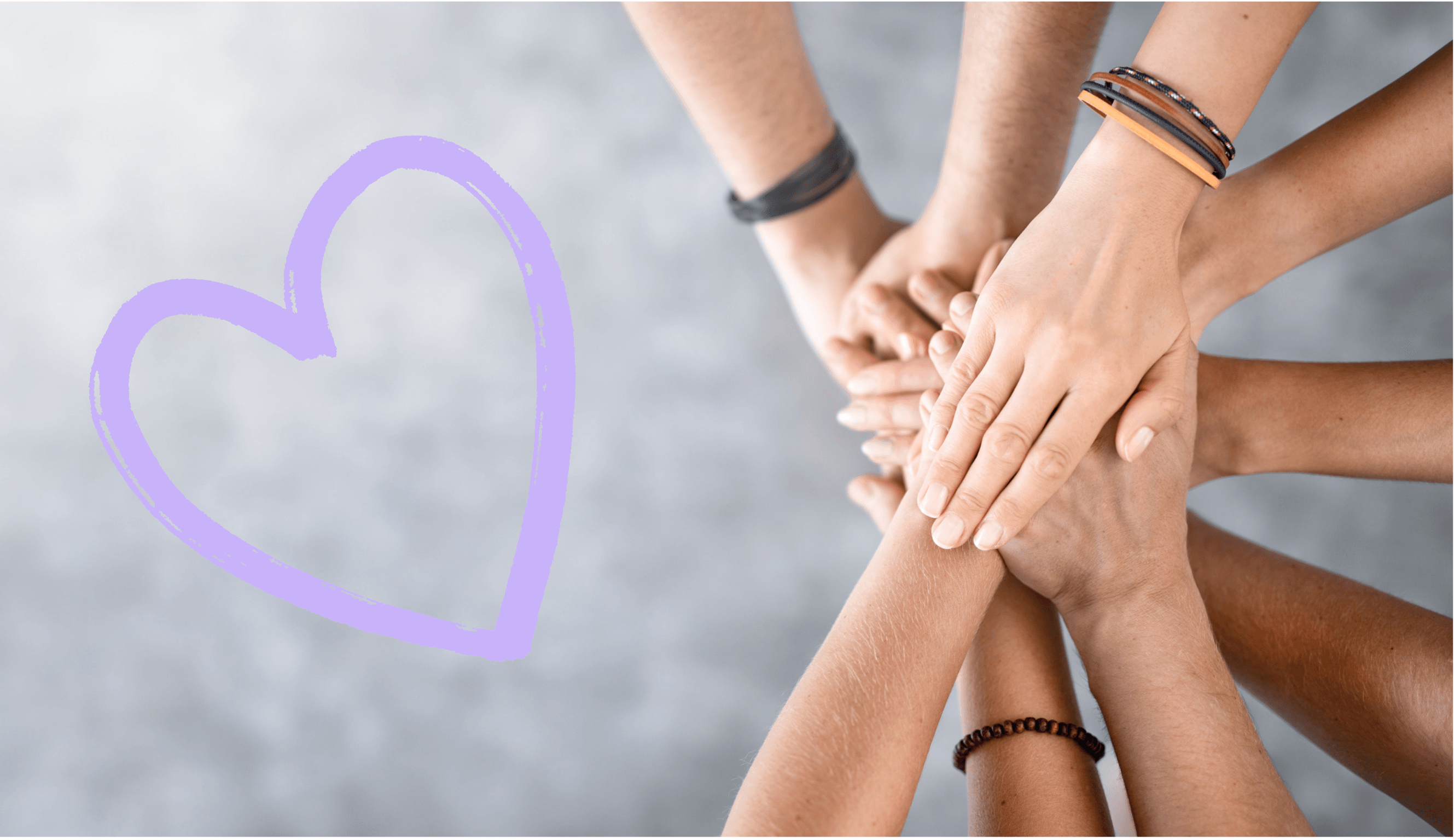 A group of diverse hands stacked in unity and support, with a soft lavender heart drawn beside them on a light grey blurred background.