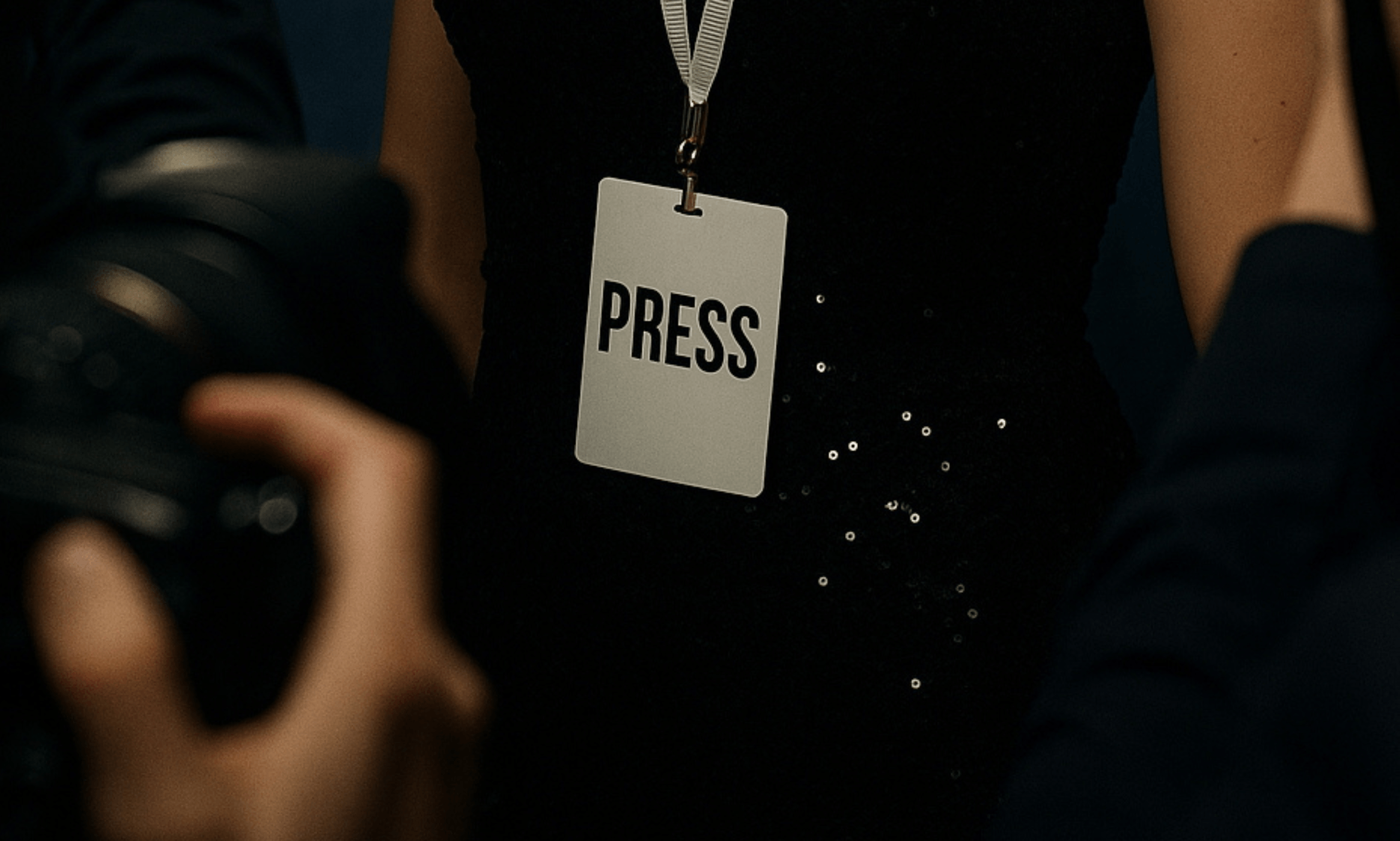 Celebrity influence - Close-up of a press badge at a red carpet event, symbolizing media visibility and PR influence.