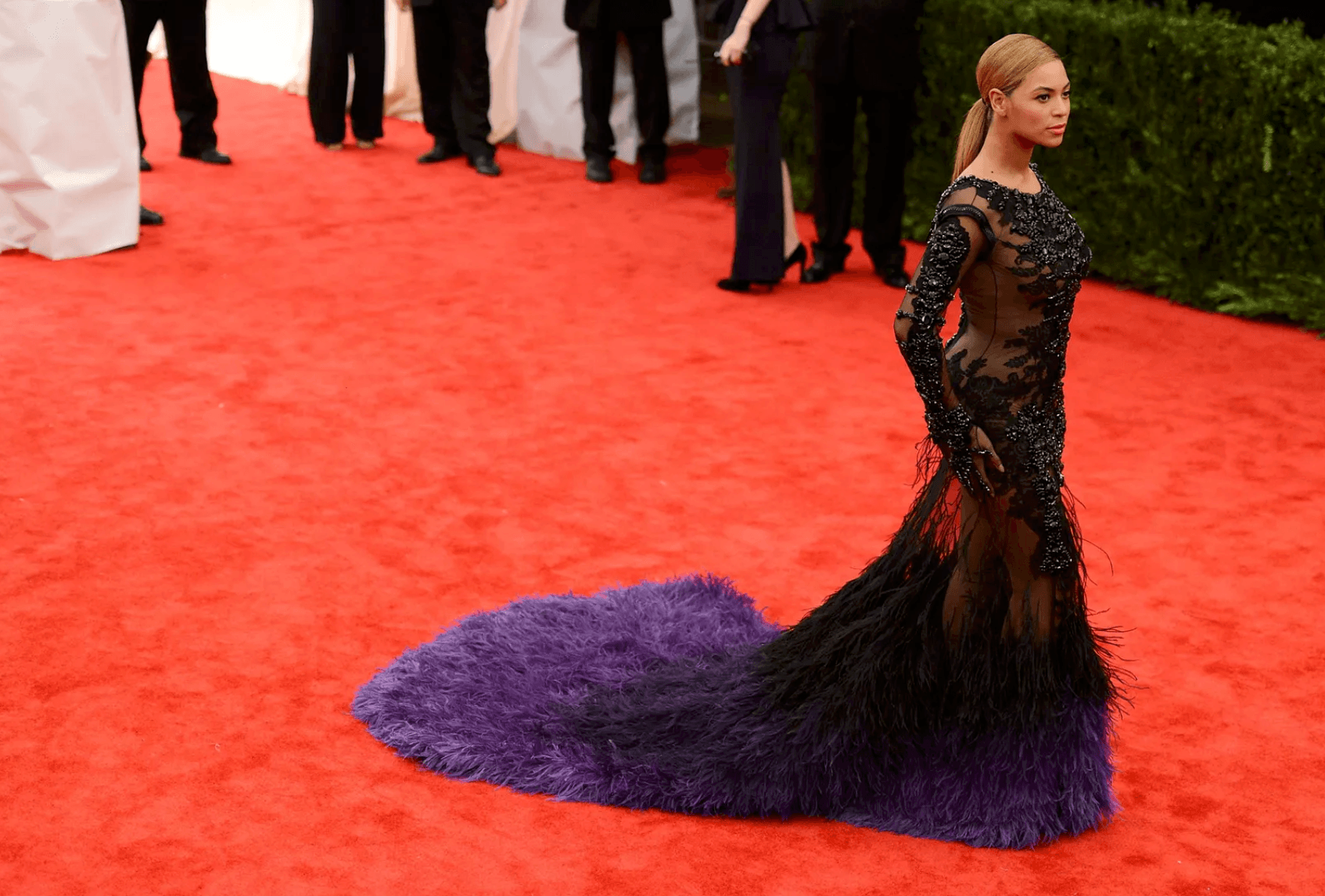 Beyoncé wearing a black and purple feathered Givenchy Haute Couture gown at the 2012 Met Gala.