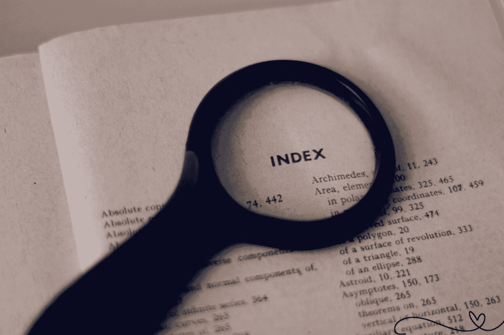 Happiness Index - Magnifying glass highlighting the word “Index” on a vintage book page, symbolizing scrutiny of the global happiness index.