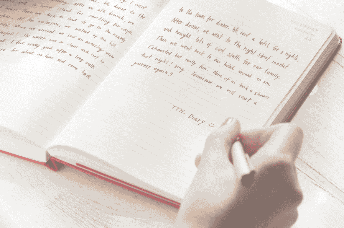 Writing instead of Therapy - Close-up of a hand writing in a personal diary