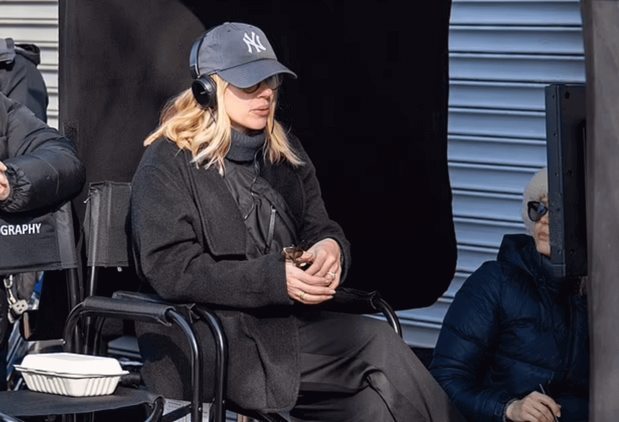 Movies directed by women - Scarlett Johansson, wearing a Yankees cap and headphones, directs on the set of her debut film Eleanor the Great.