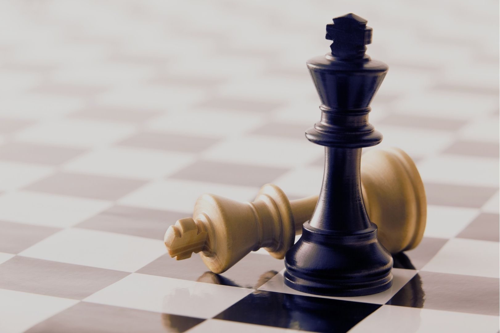 Narcissist Relationship Playbook - A brown chess king stands while a lighter king lies toppled—symbolizing dominance and discard.