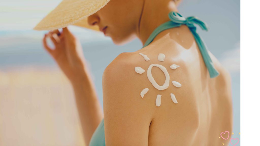 Sunscreen tattoo trend - A woman with a sun symbol drawn on her back using sunscreen, representing the viral TikTok sunscreen tattoo trend.