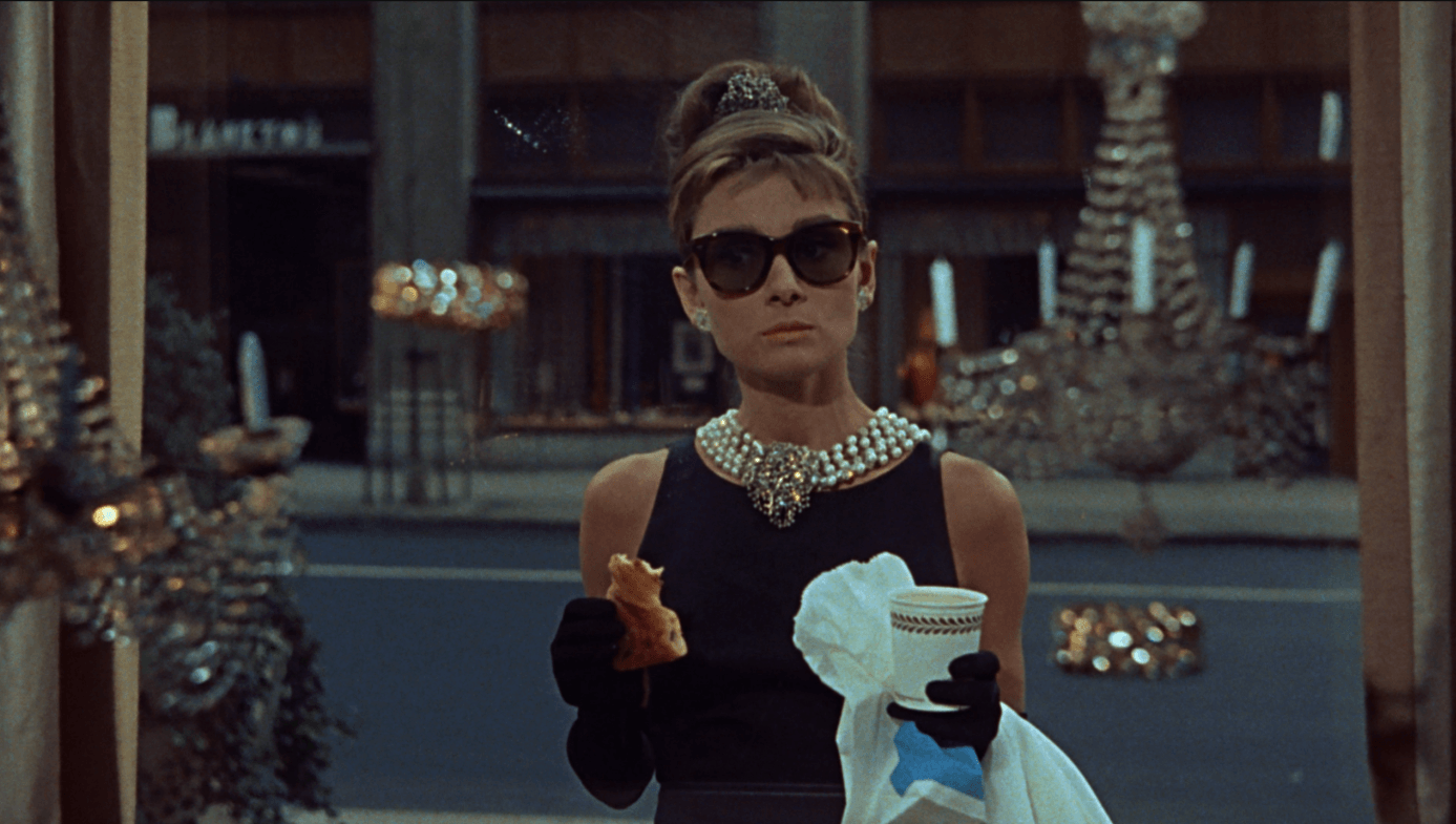 Diamond symbolize love – Audrey Hepburn in Breakfast at Tiffany’s wearing pearls and diamonds while gazing into a jewelry shop window.