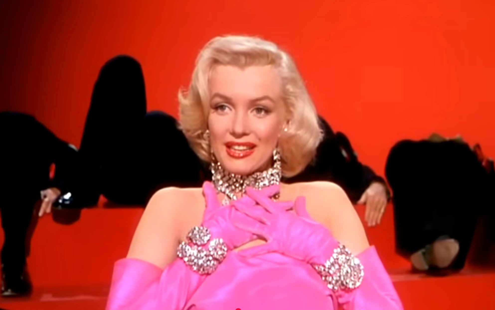 Diamond symbolizes love — Marilyn Monroe playfully draped in jewels during Diamonds Are a Girl’s Best Friend, where marketing met romance in pop culture sparkle.