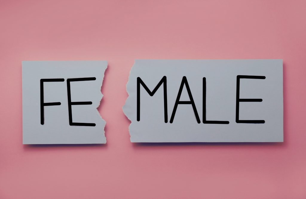 Top-Tier Man - Ripped word “Female” showing divide in gender roles